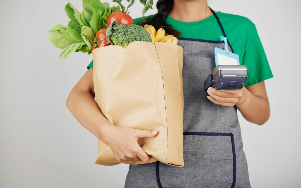 sales lady holding vegetables
